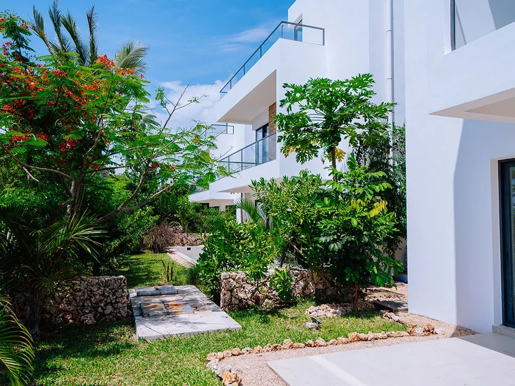Garden with palm trees and landscaping at 3BR townhouse in Zanzibar, Zanzibar Tanzania