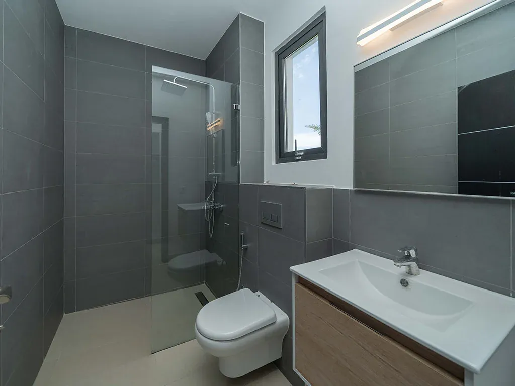 Bathroom with modern sink and cabinetry in 5-bedroom townhouse, Zanzibar, Tanzania